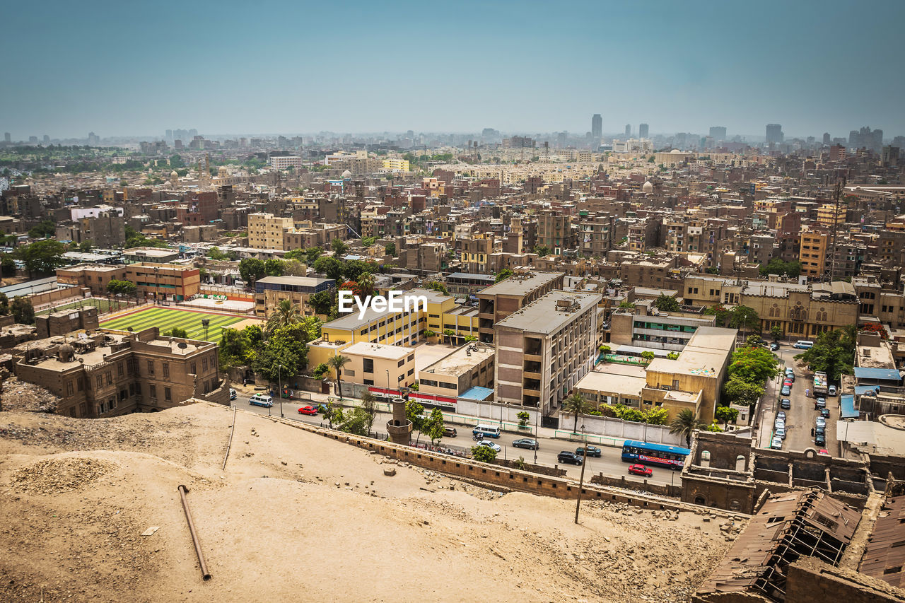 Scenic view of town against clear sky