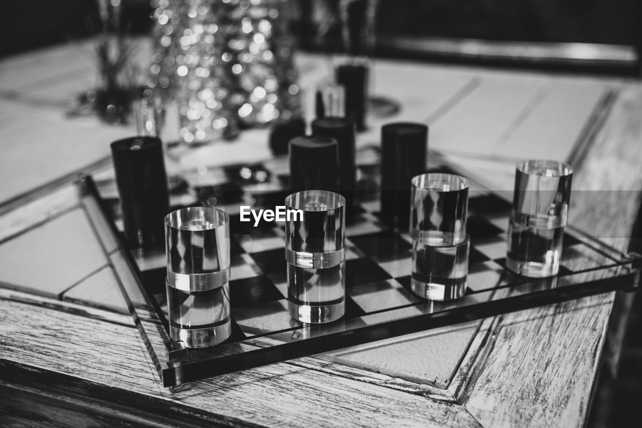 HIGH ANGLE VIEW OF GLASSES ON TABLE AT HOME