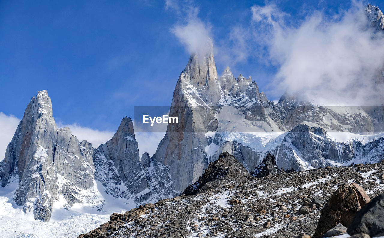 Panoramic view of snowcapped mountains against sky