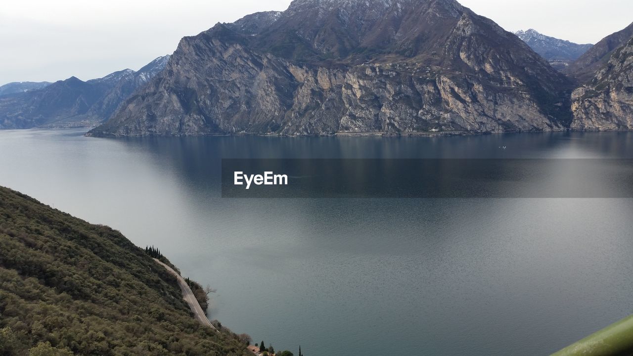 Scenic view of lake and mountains against sky