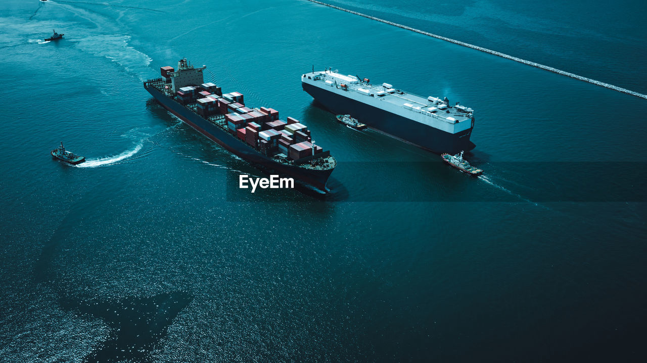 High angle view of shipping container sailing on sea