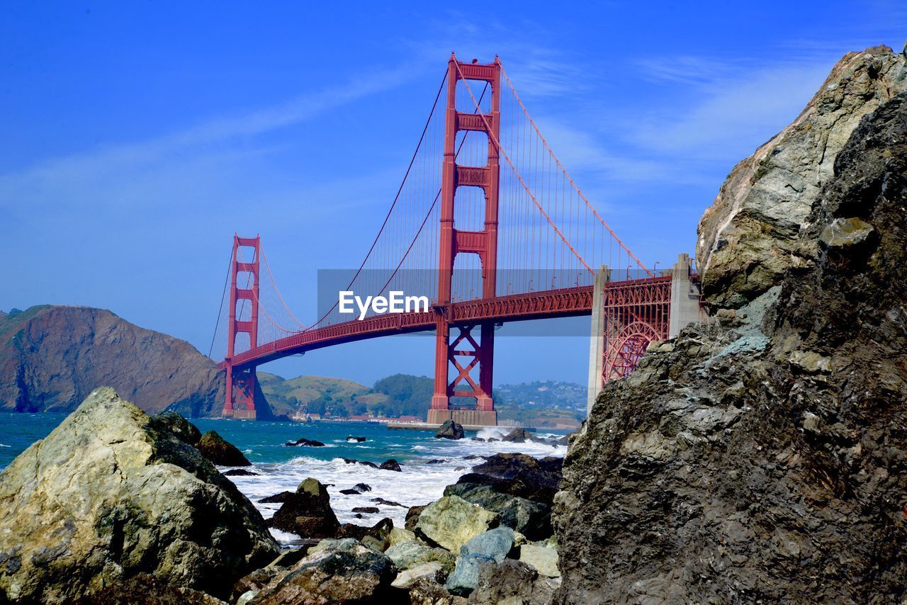 Golden gate bridge over bay against sky