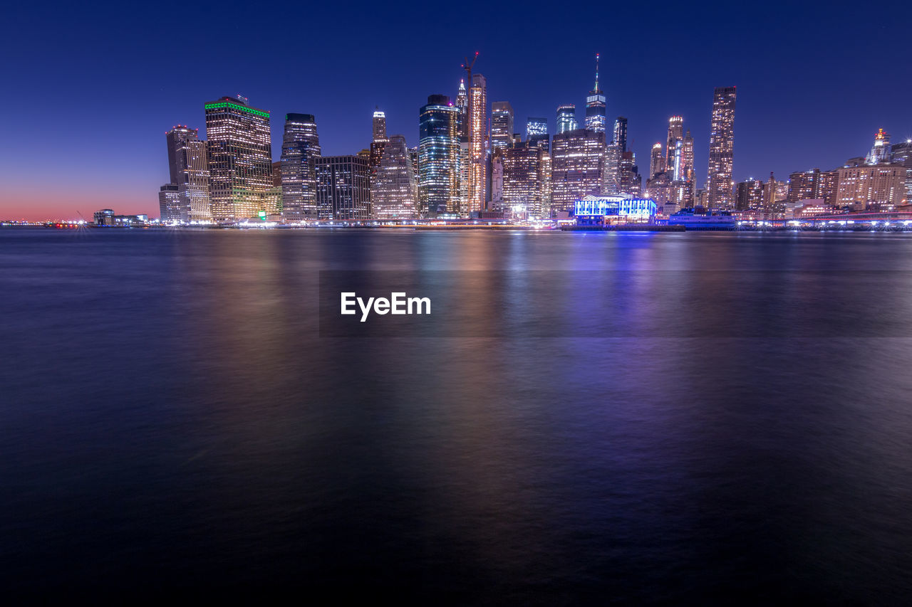 Illuminated buildings in city at night