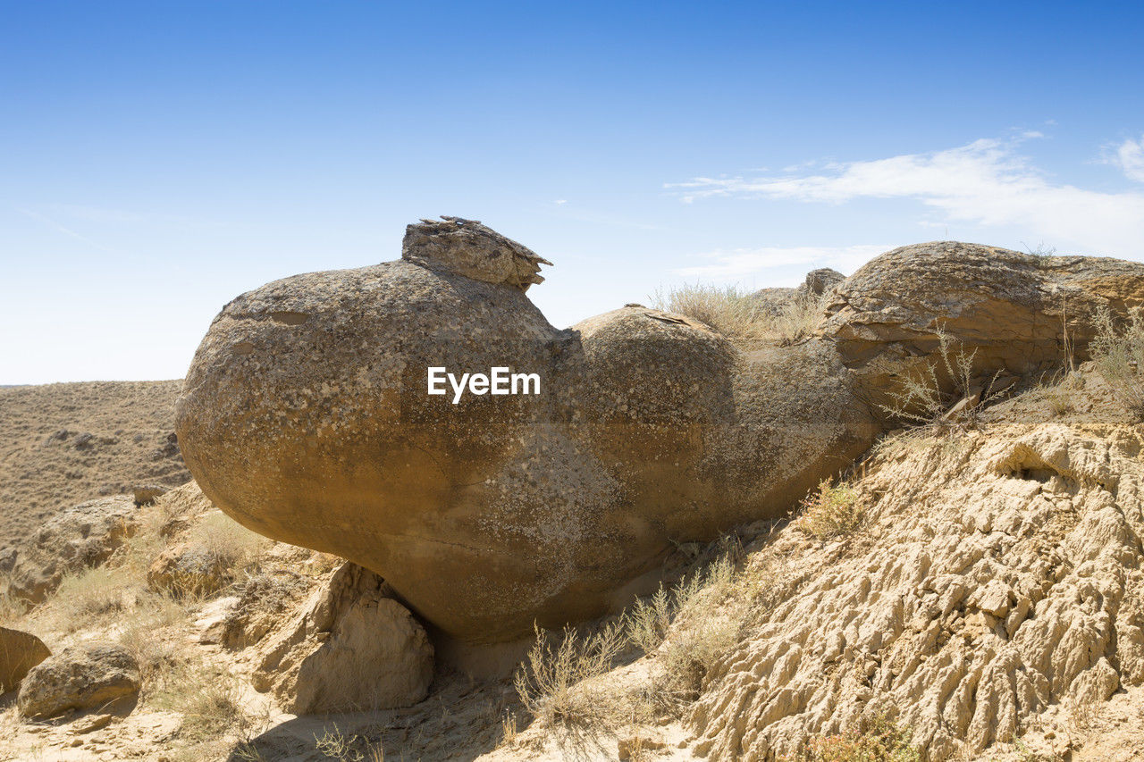 close-up of rock formations against clear blue sky