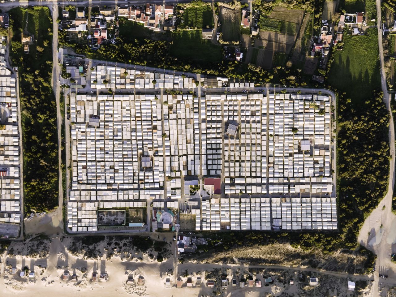 HIGH ANGLE VIEW OF CARS ON BUILDING