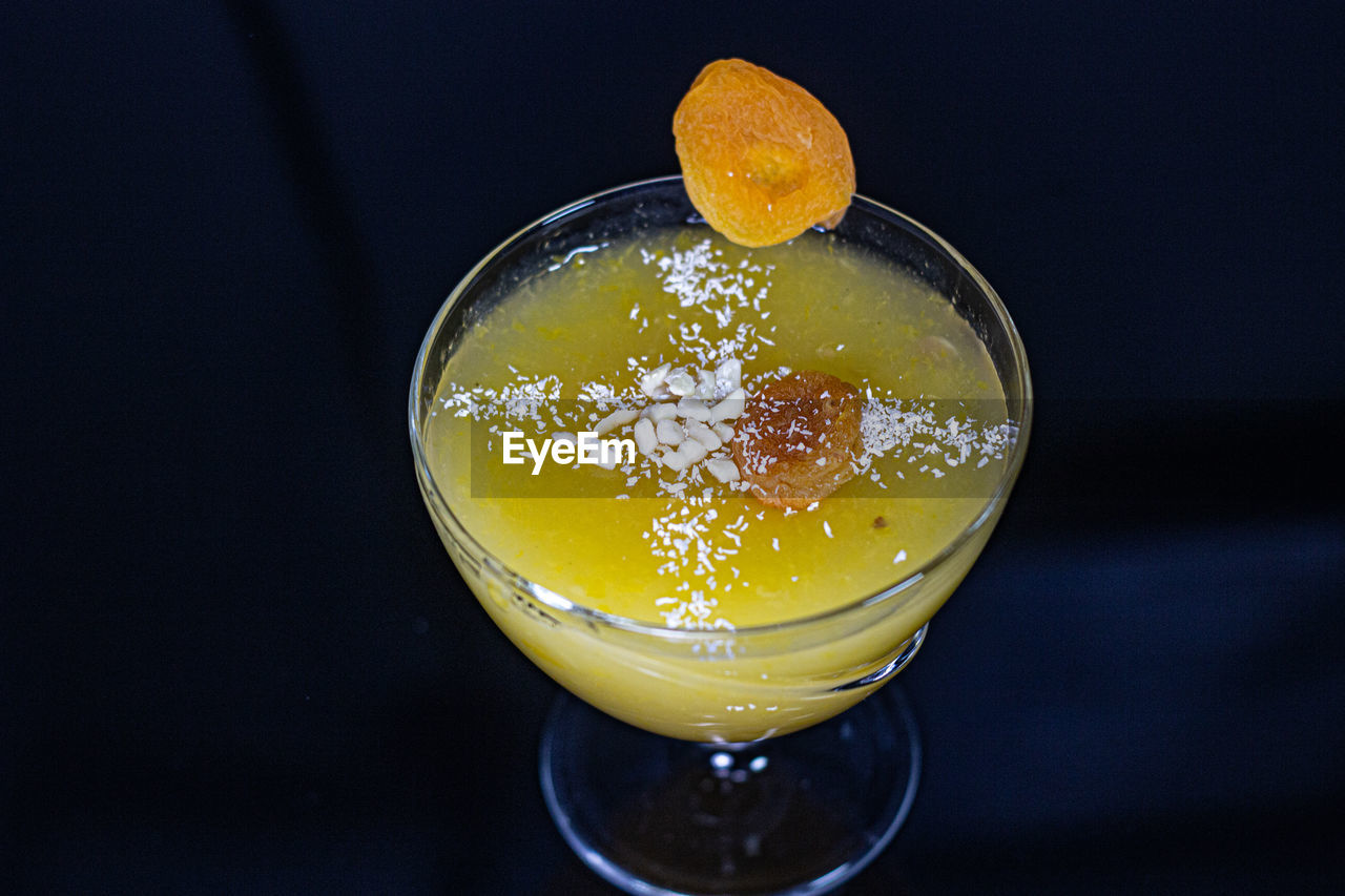 High angle view of drink over black background