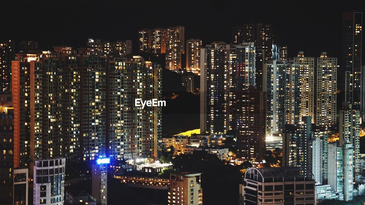 Illuminated buildings in city at night