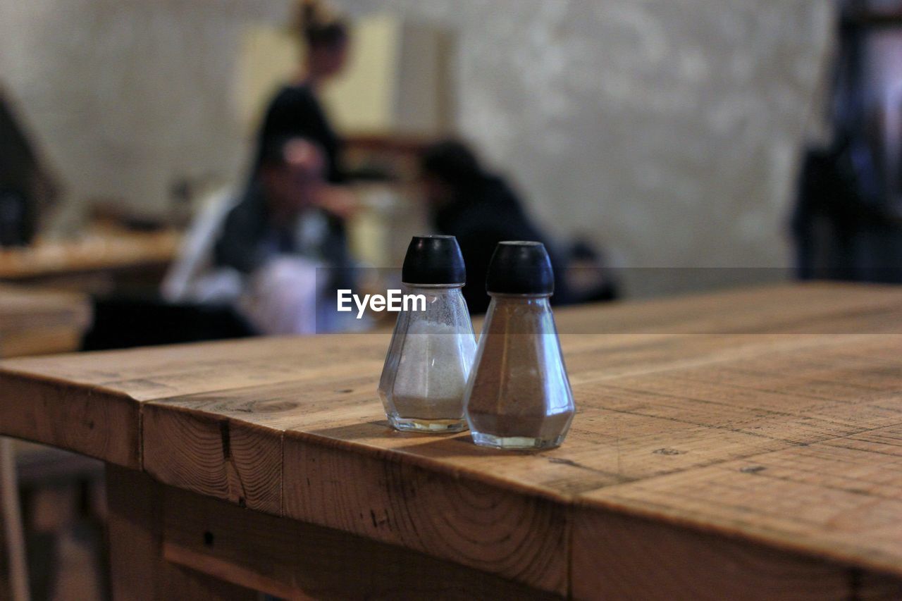 Salt and pepper shaker on table at restaurant