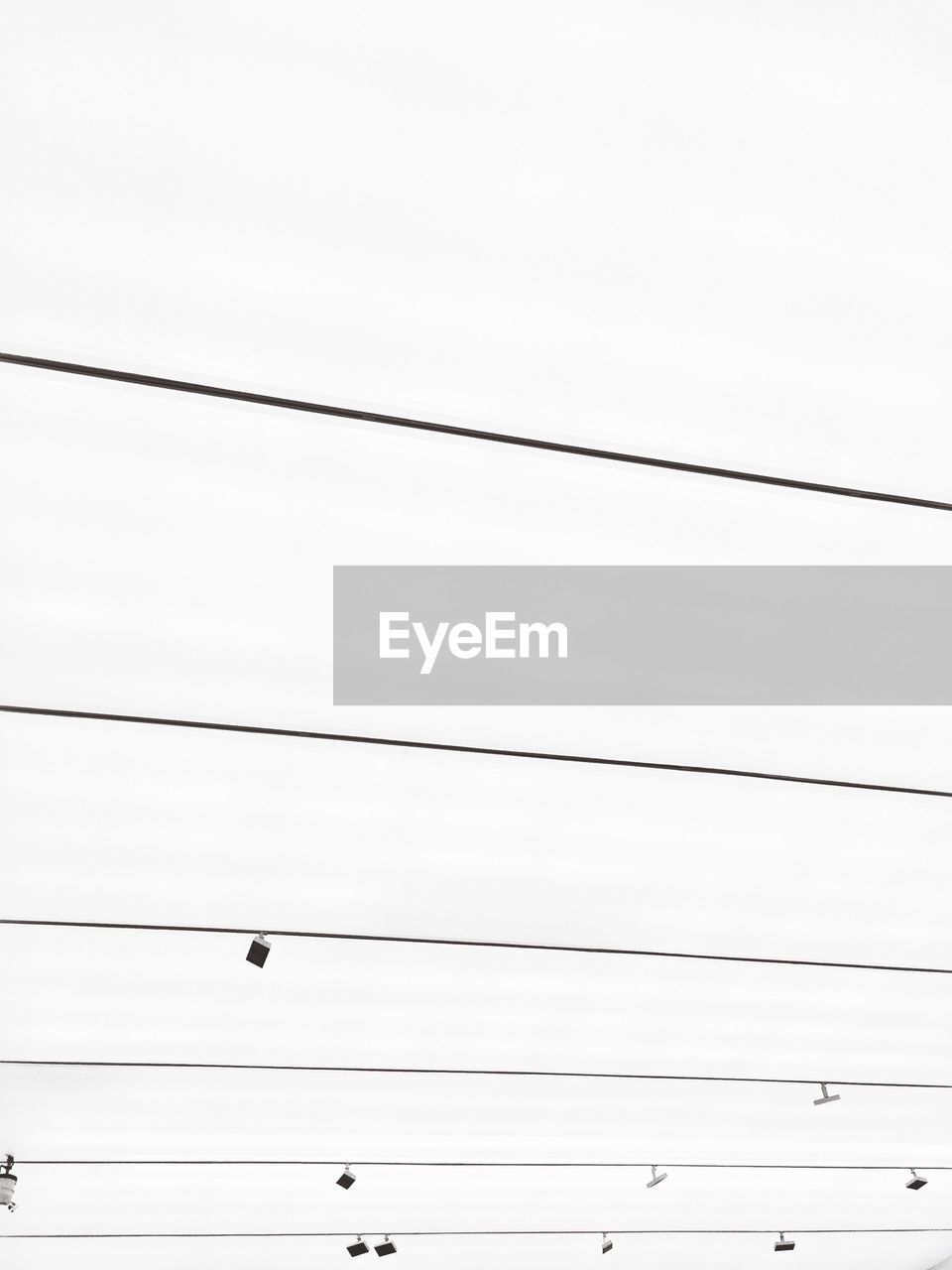 Low angle view of cables against clear sky