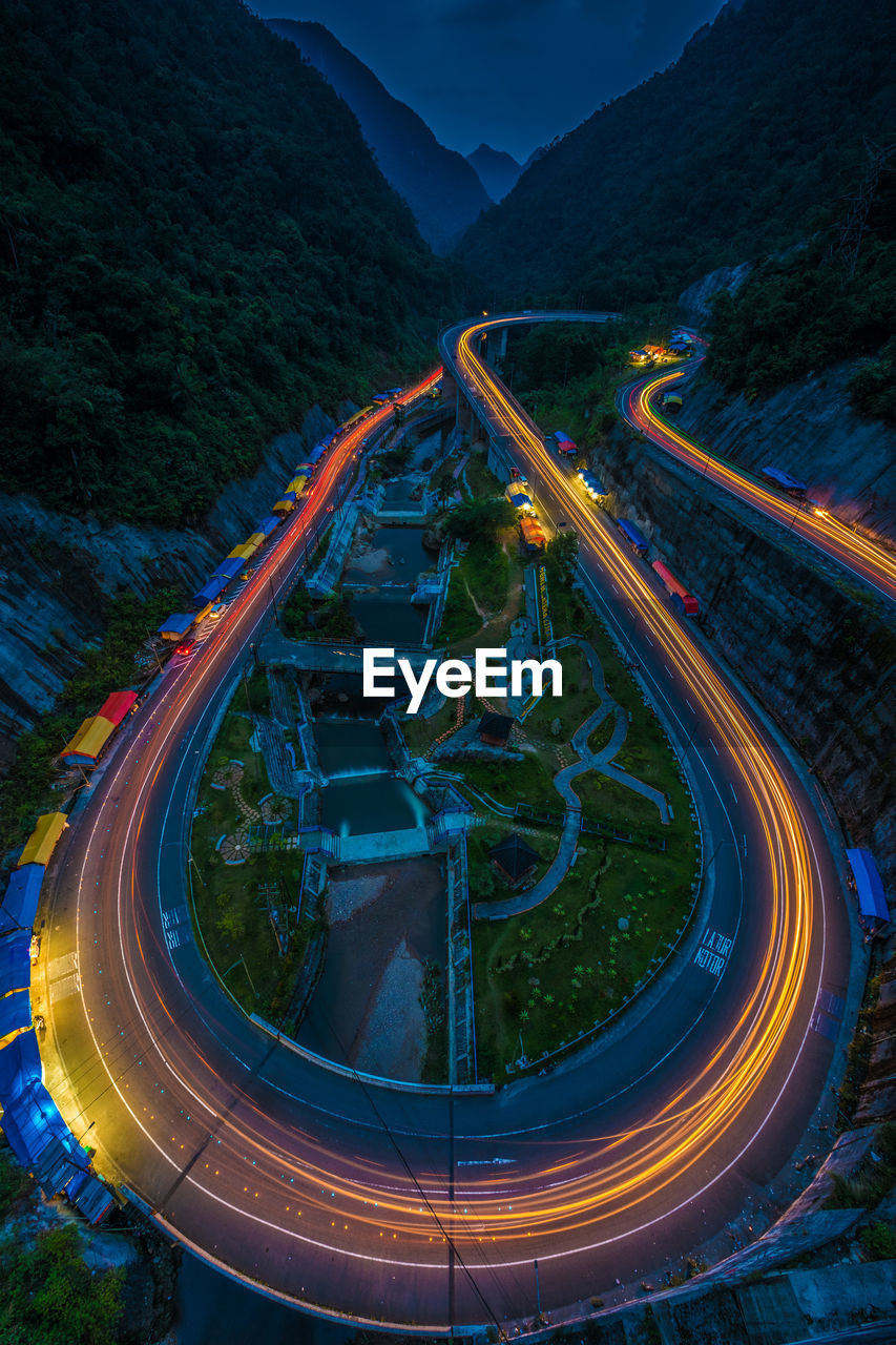 High angle view of light trails on road