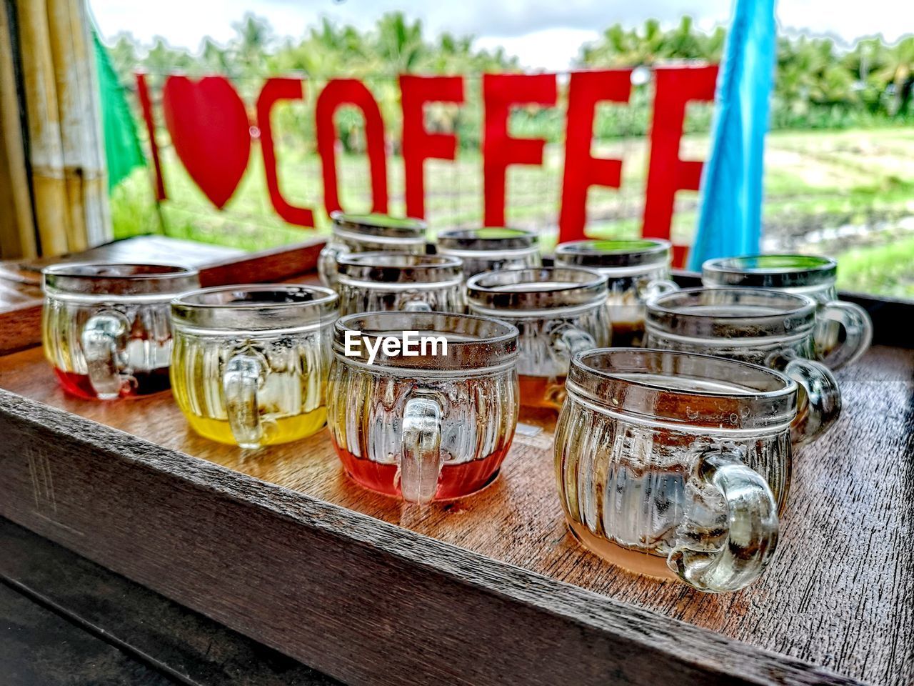 CLOSE-UP OF GLASSES ON TABLE