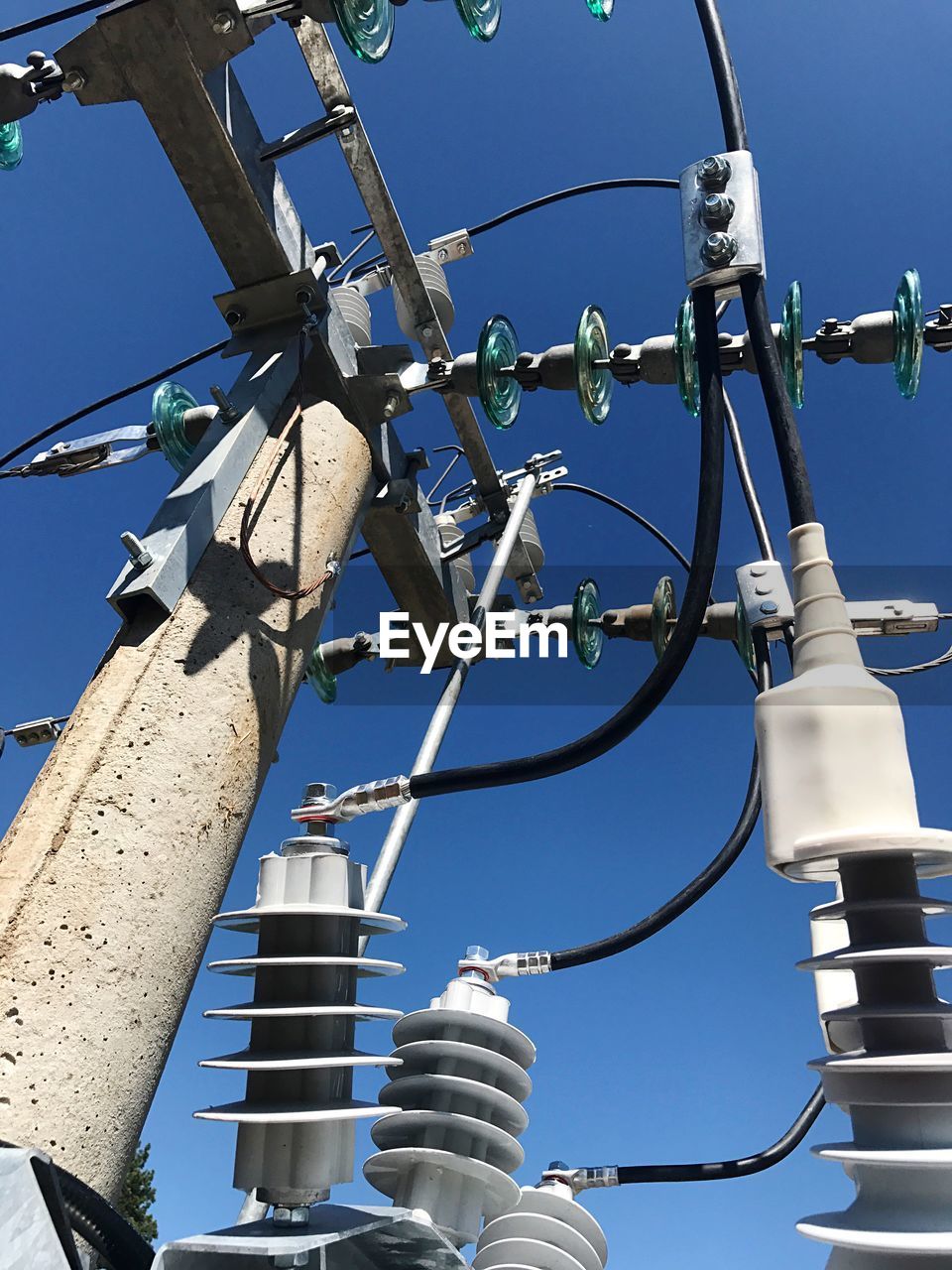 LOW ANGLE VIEW OF CABLES AGAINST CLEAR SKY