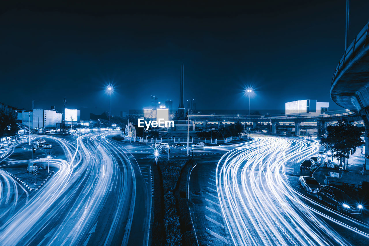 High angle view of light trails on highway at night