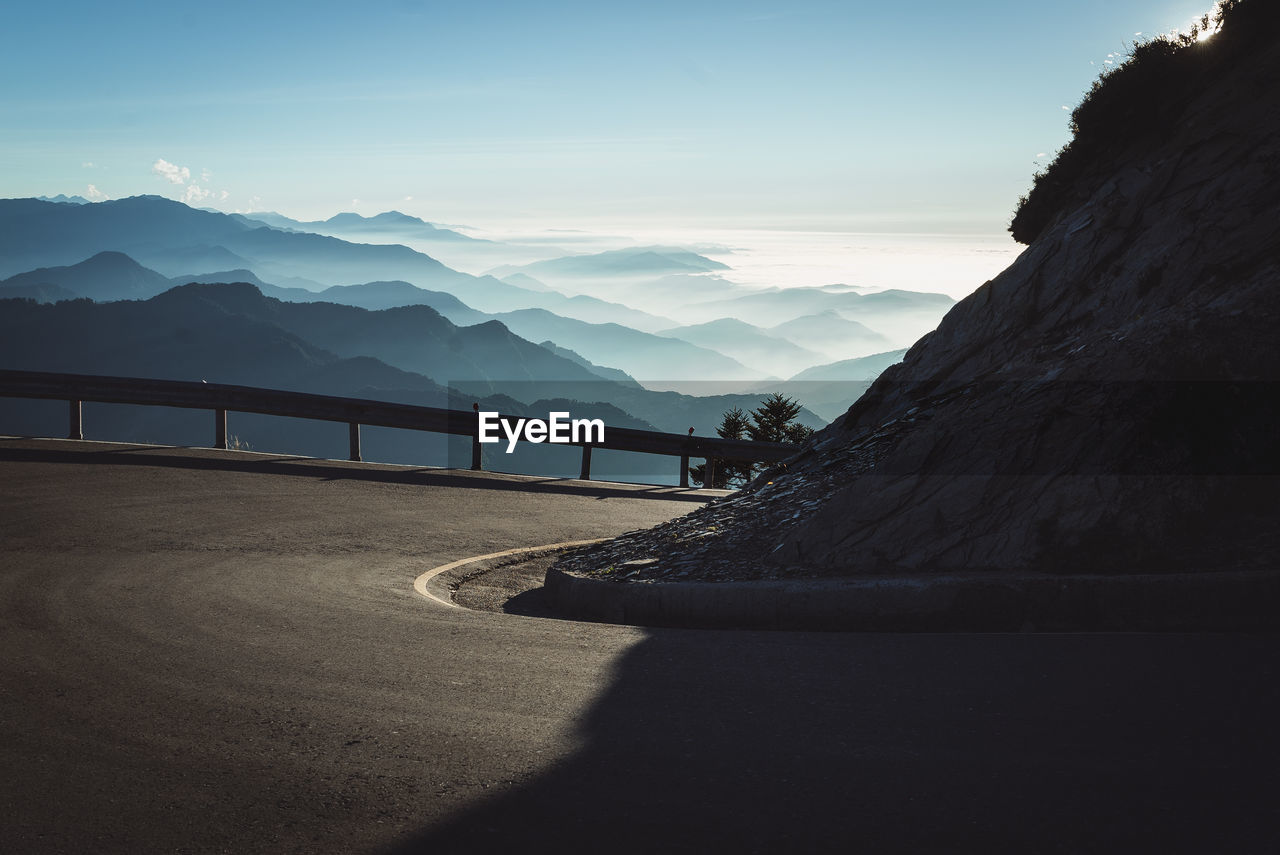 Scenic view of mountain road against sky