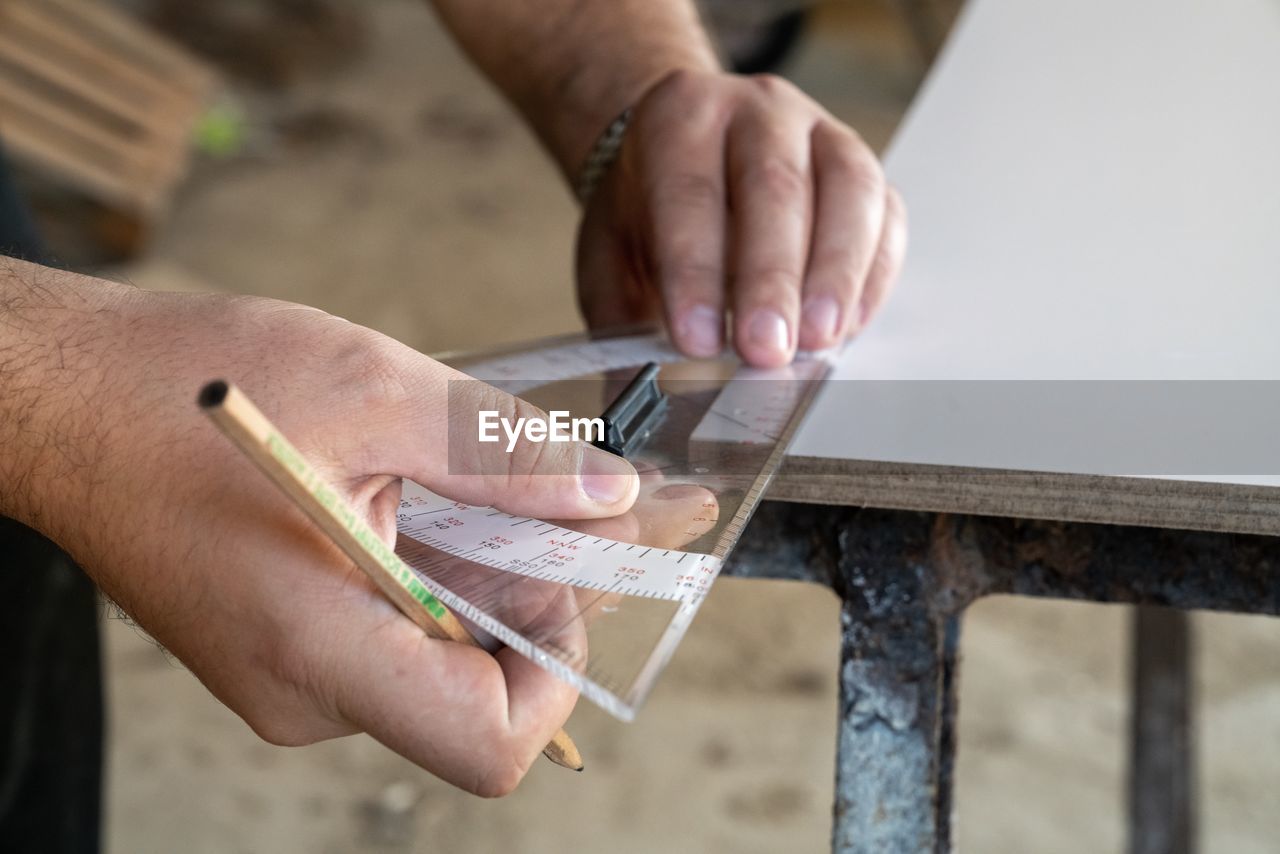 Close-up of man working on table