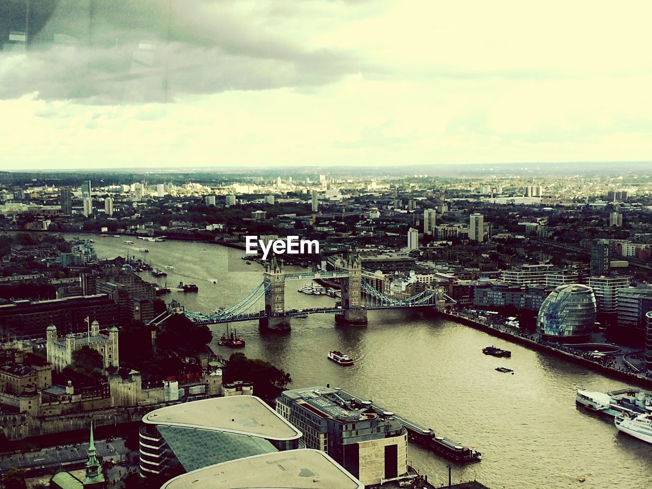 High angle view of tower bridge over thames river in city against sky