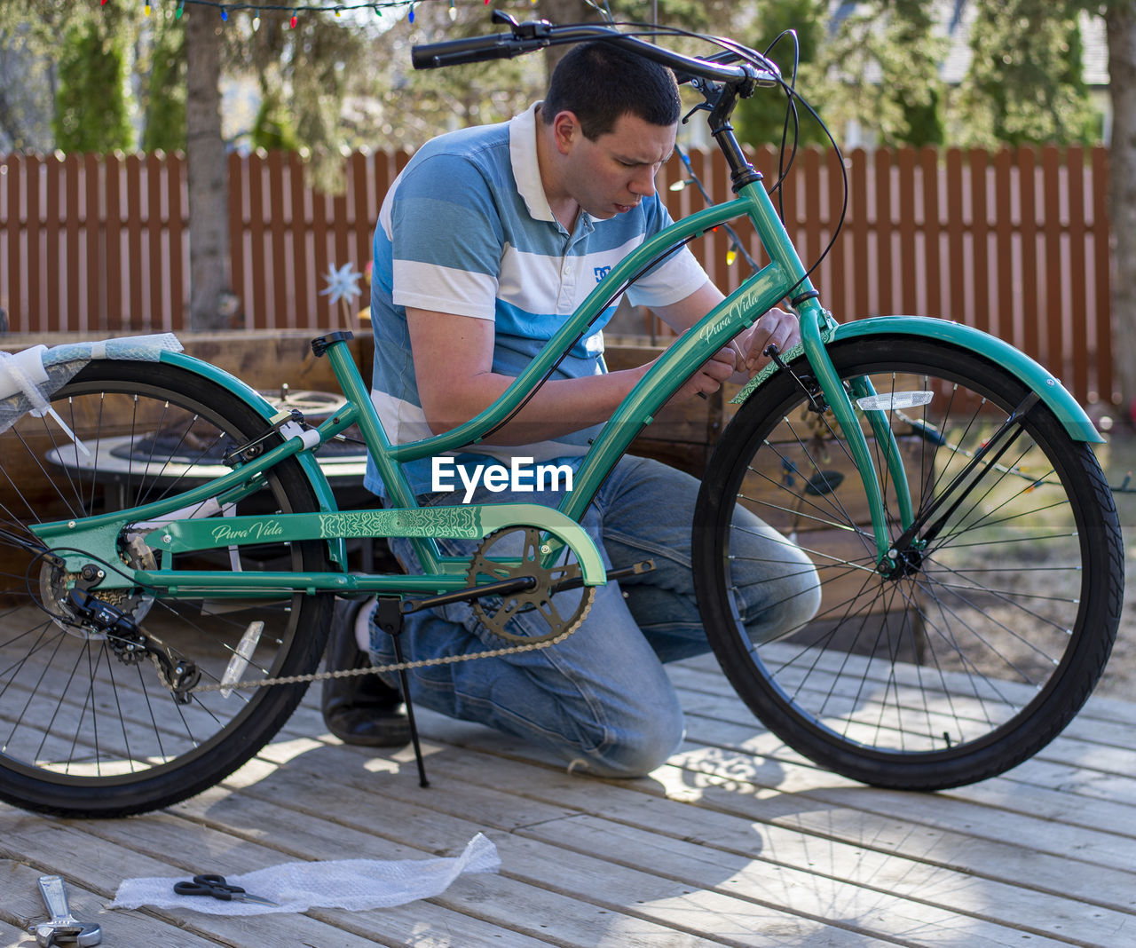 MAN RIDING BICYCLE