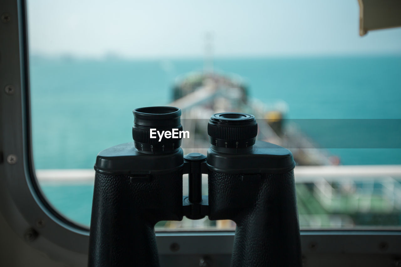 Close-up of binoculars on ship