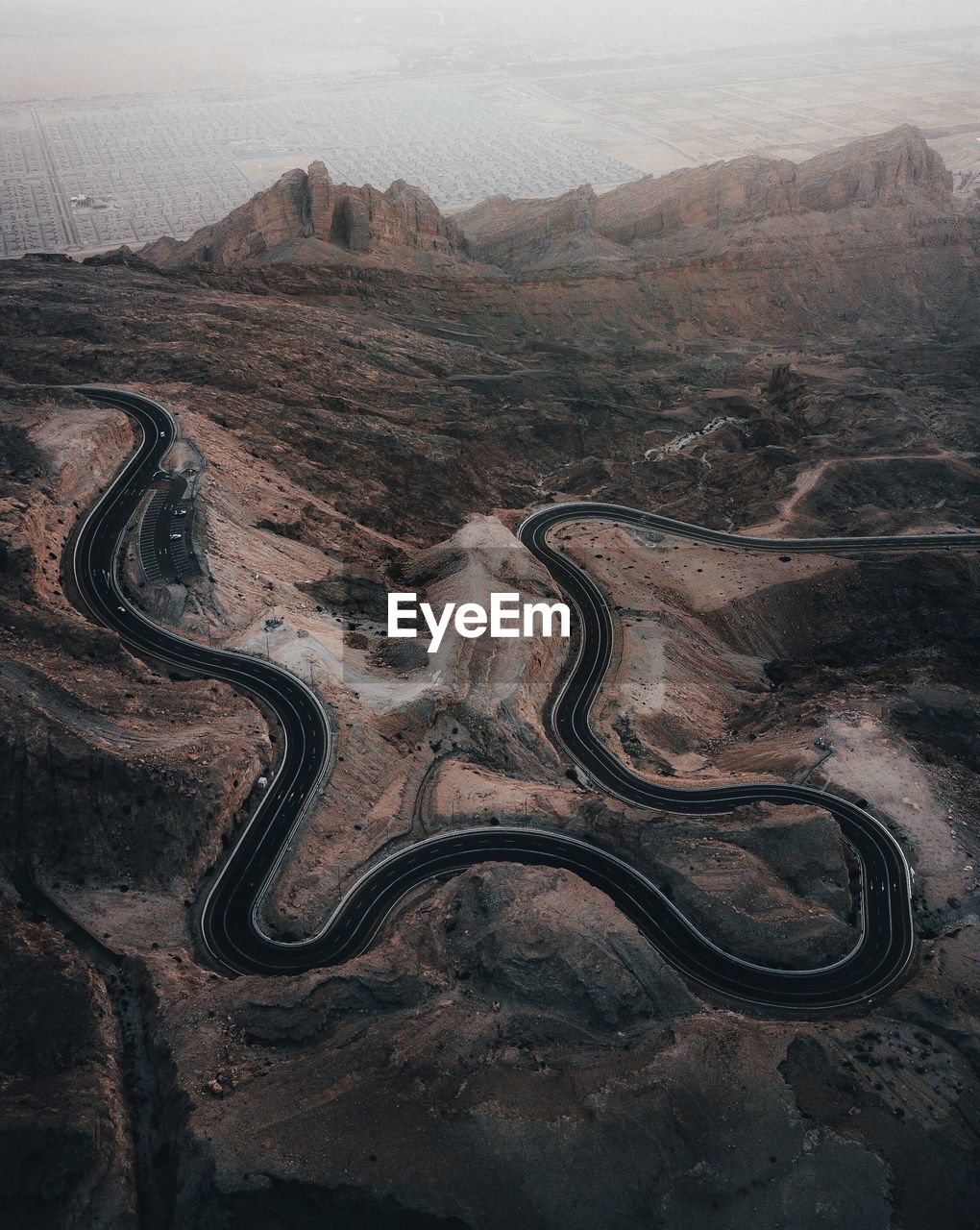 High angle view of winding road on land