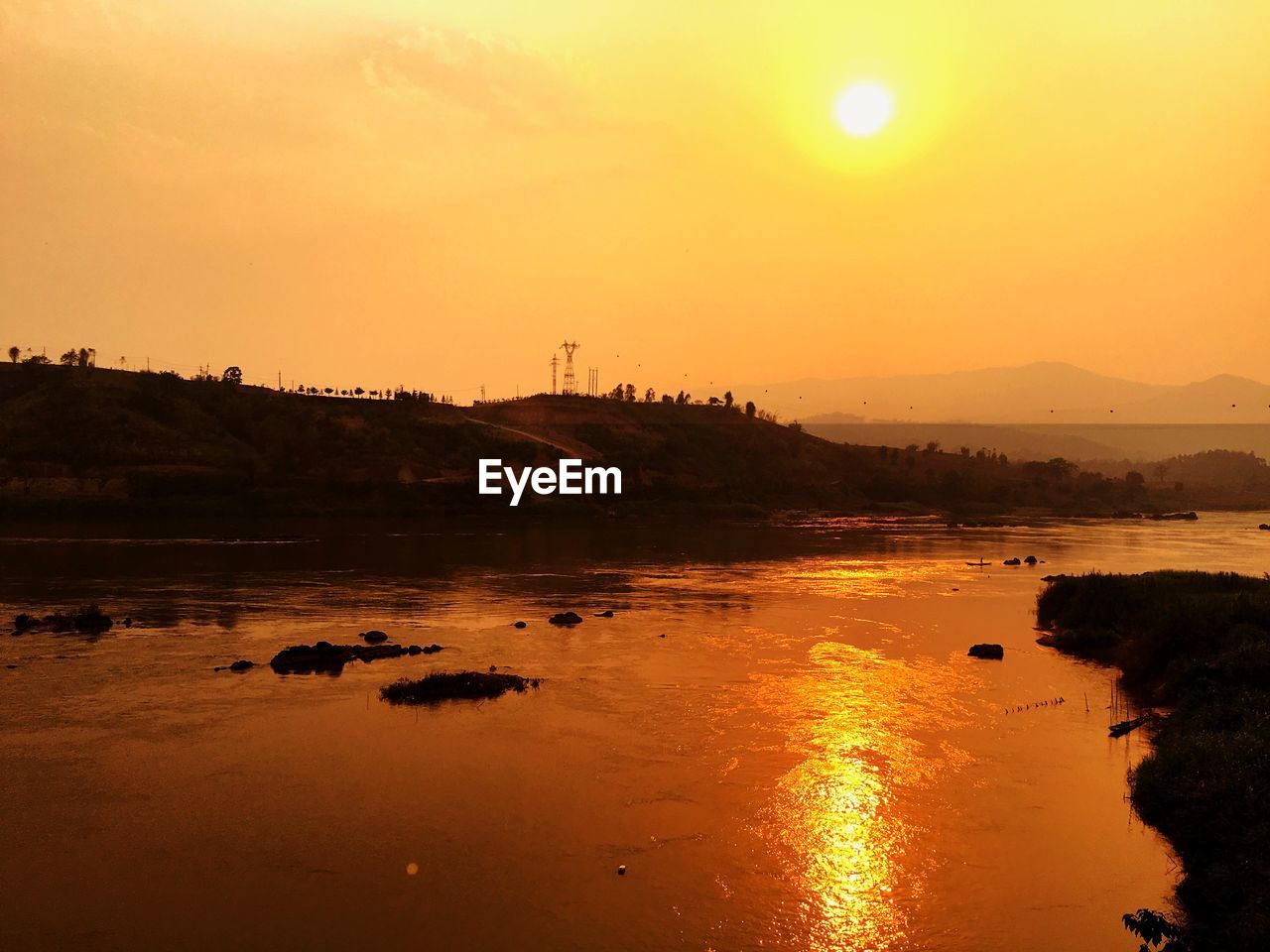 Scenic view of sunset over river