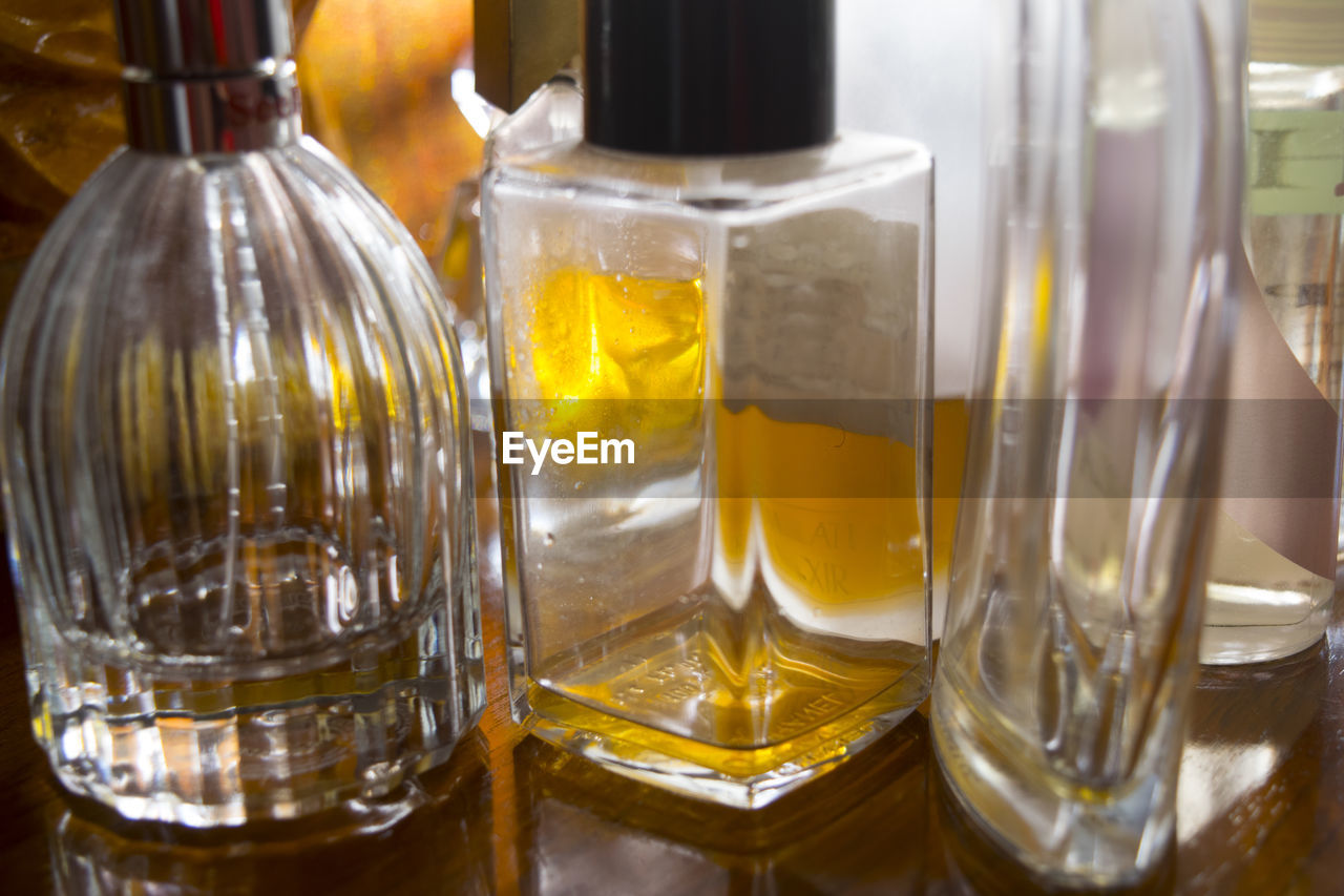 Close-up of perfumes on table