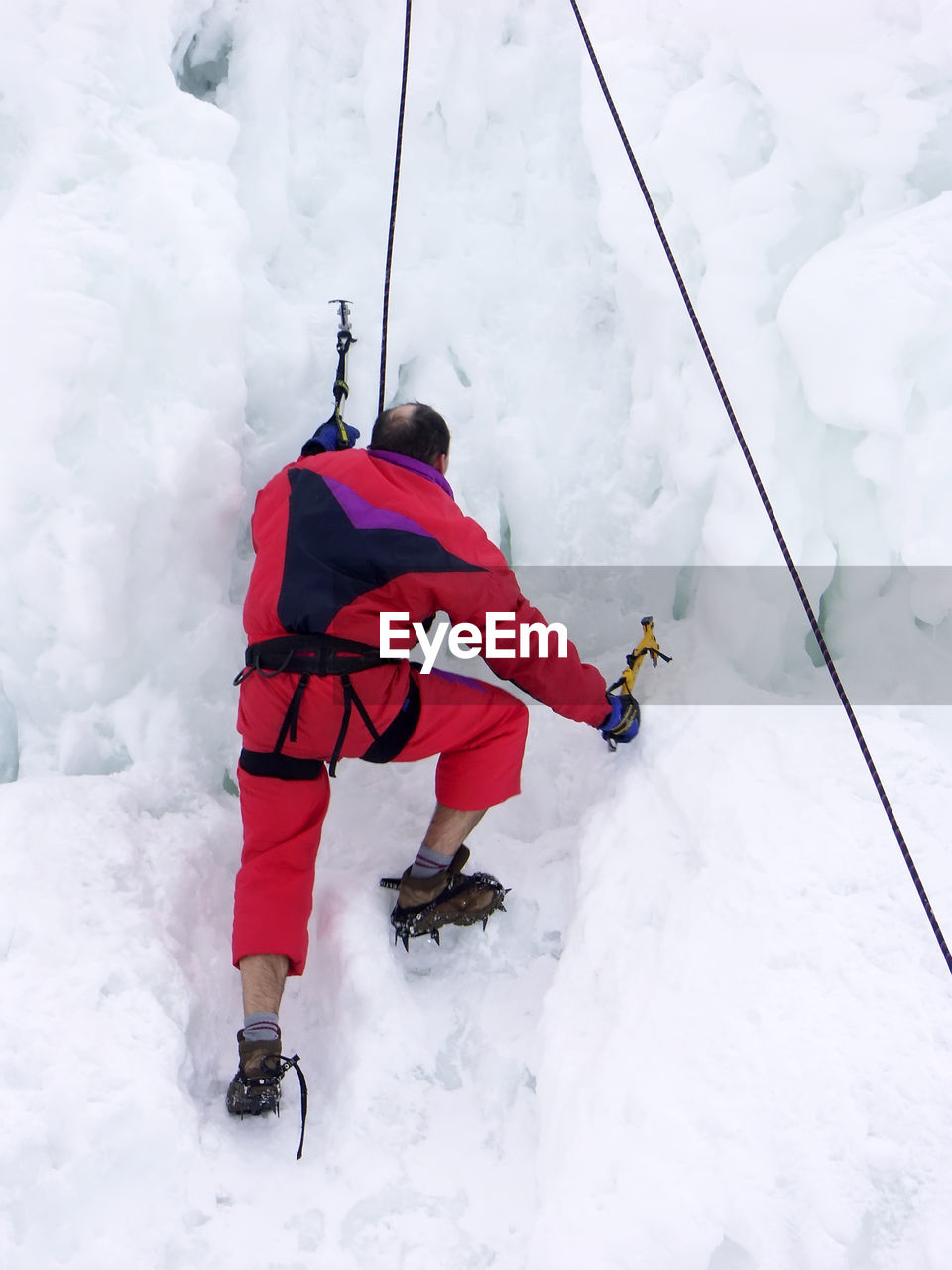 Climber climbing the iceberg