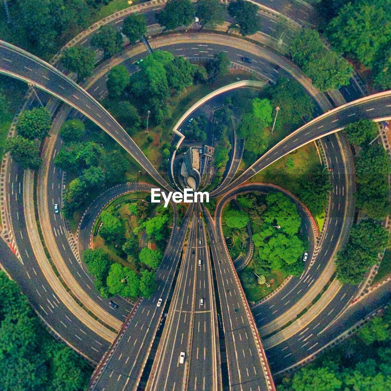 High angle view of road amidst trees in city