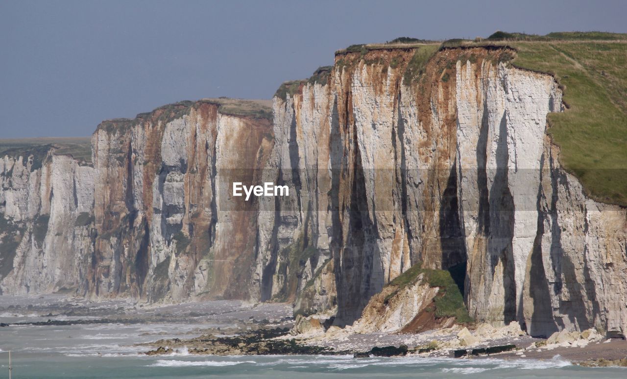 Scenic view of rock formations against sky