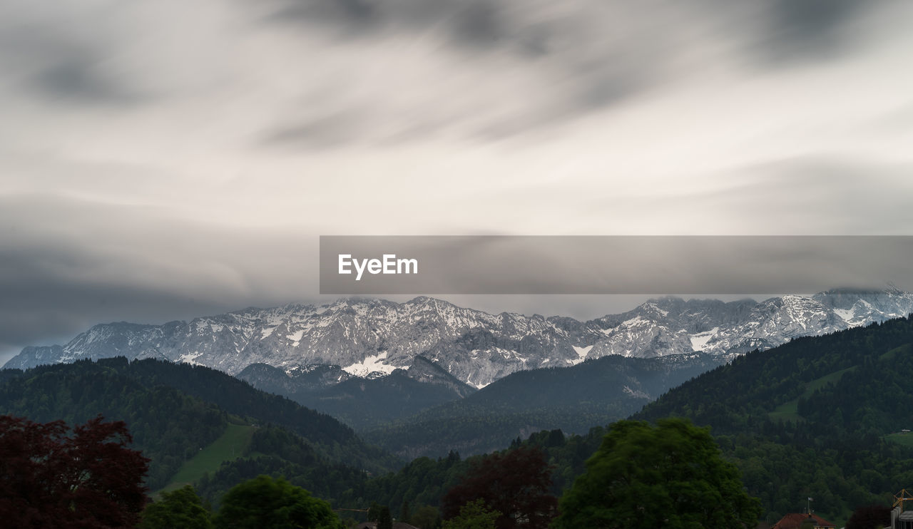 Scenic view of mountains against sky during winter