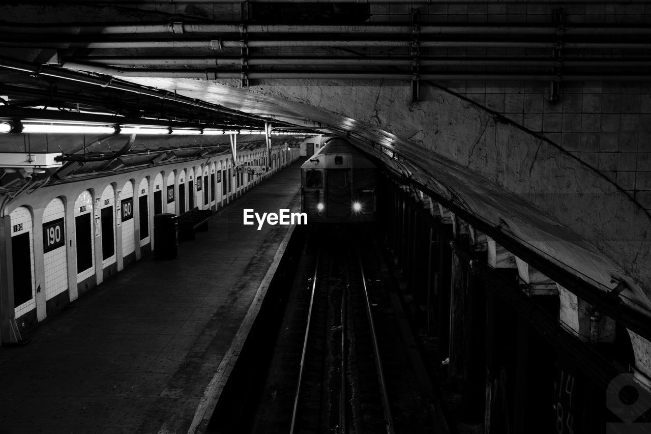 Train at railroad station at night