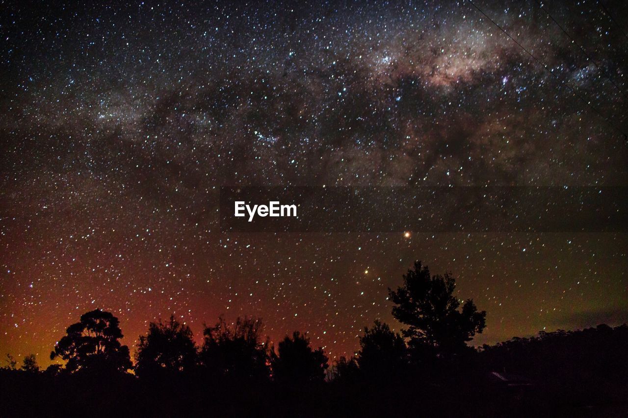 LOW ANGLE VIEW OF STARS IN SKY AT NIGHT