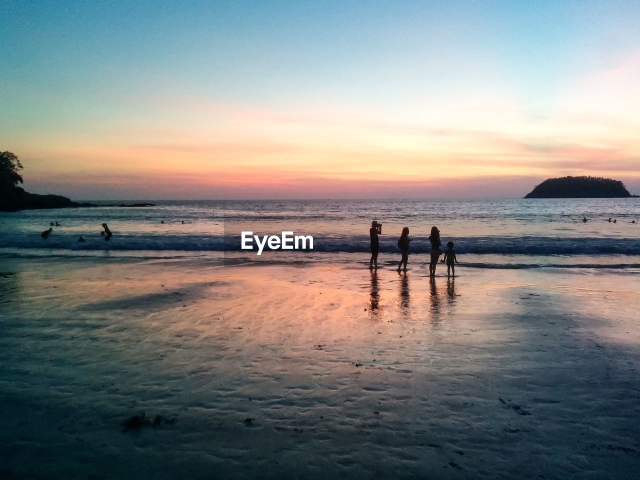 SILHOUETTE PEOPLE AT BEACH DURING SUNSET