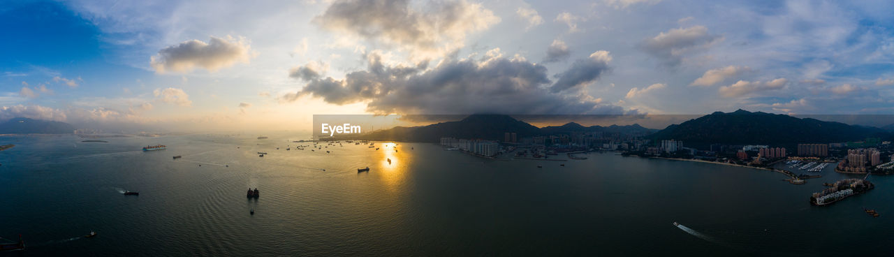 PANORAMIC VIEW OF BAY AGAINST SKY DURING SUNSET