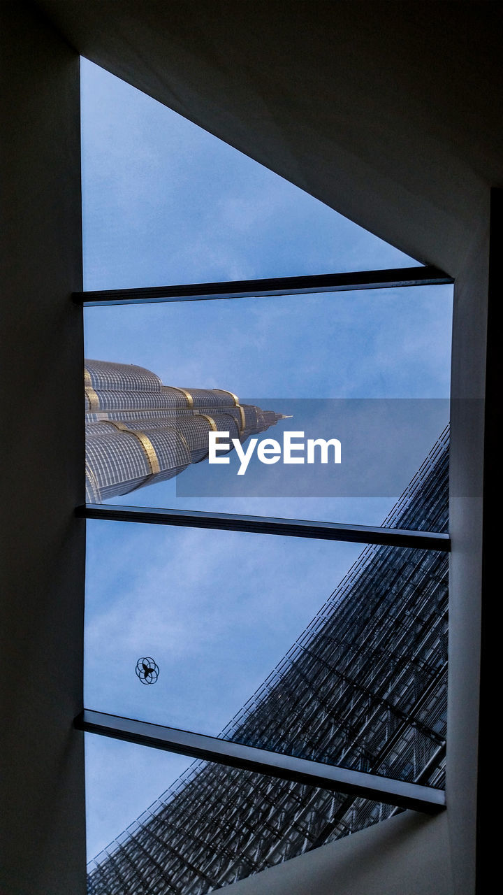 LOW ANGLE VIEW OF BUILDINGS AGAINST SKY