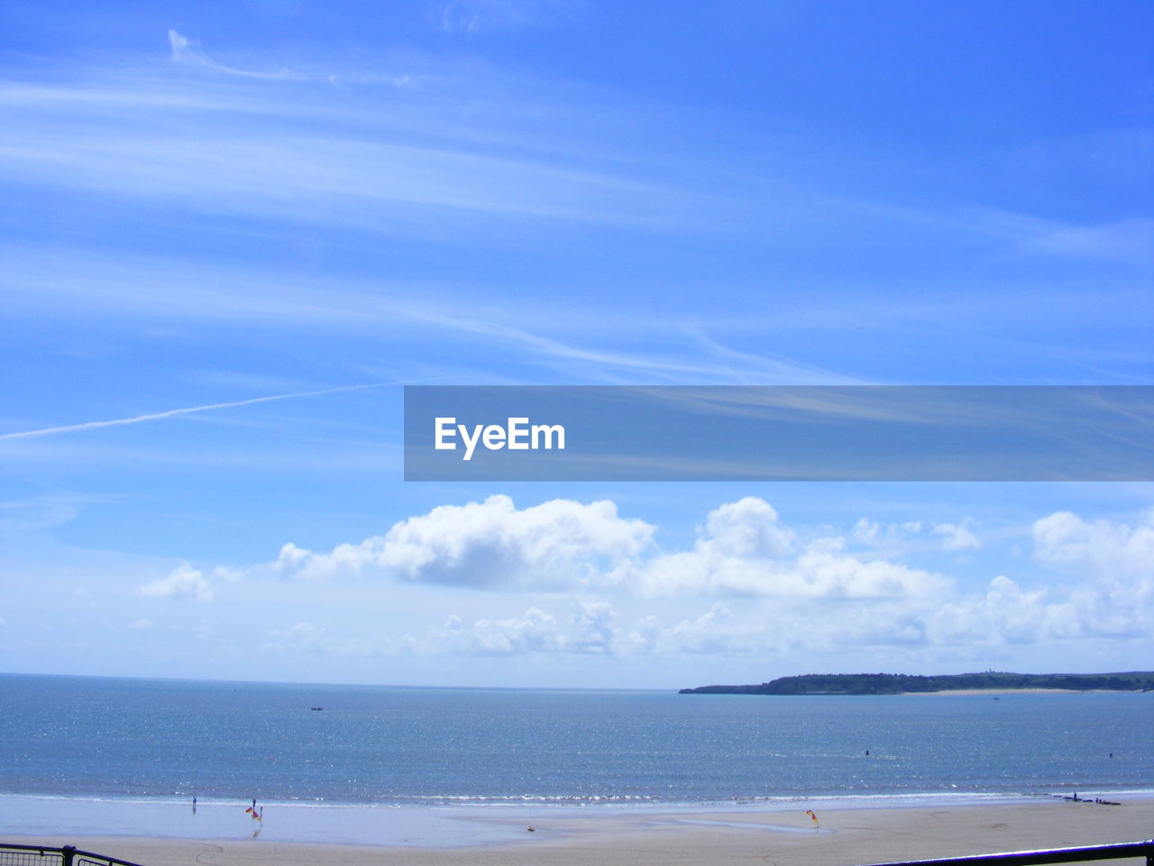 Scenic view of sea against blue sky