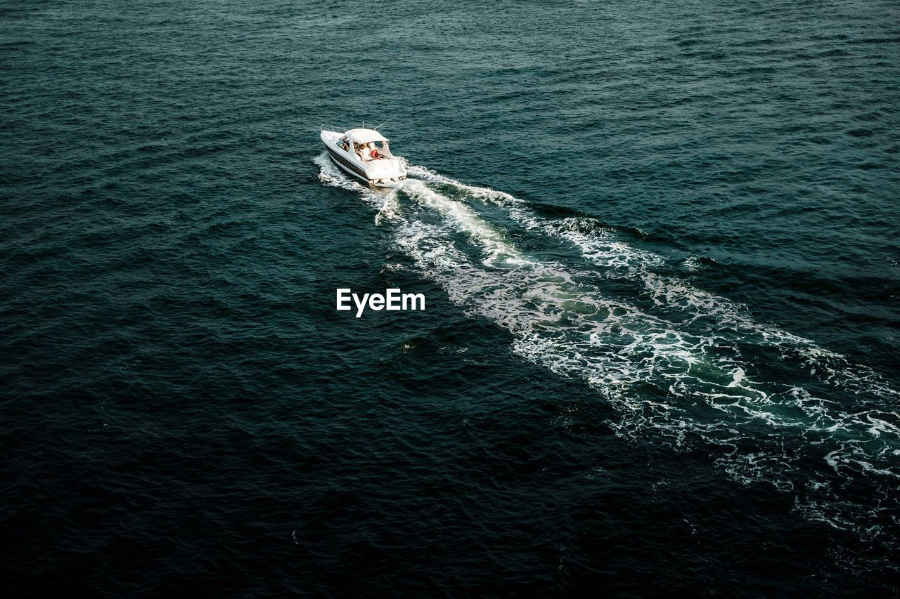 High angle view of motorboat sailing in sea