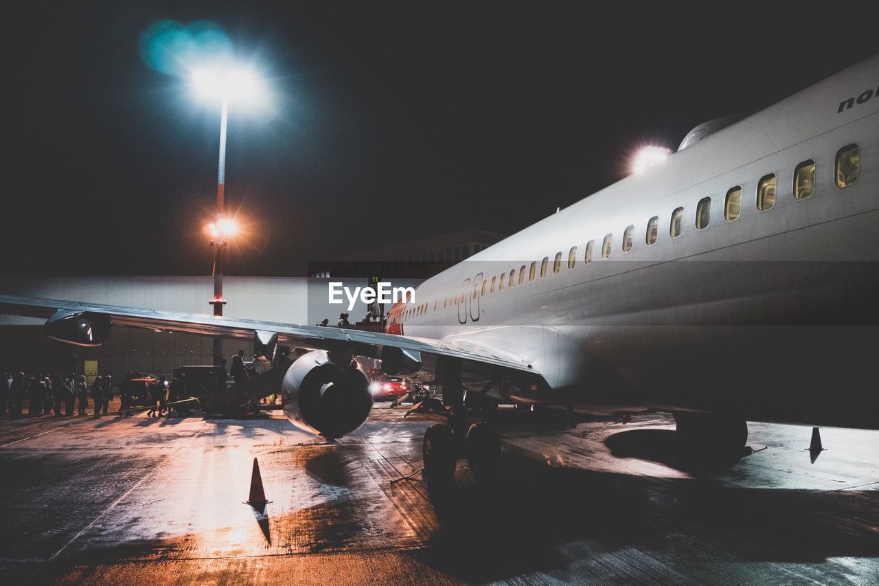 AIRPLANE AT AIRPORT RUNWAY