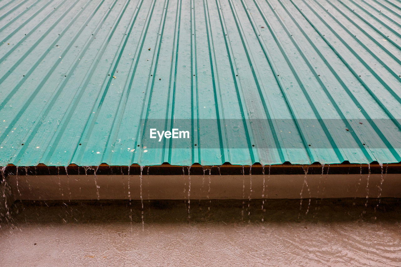 Raindrops on corrugated metal roof