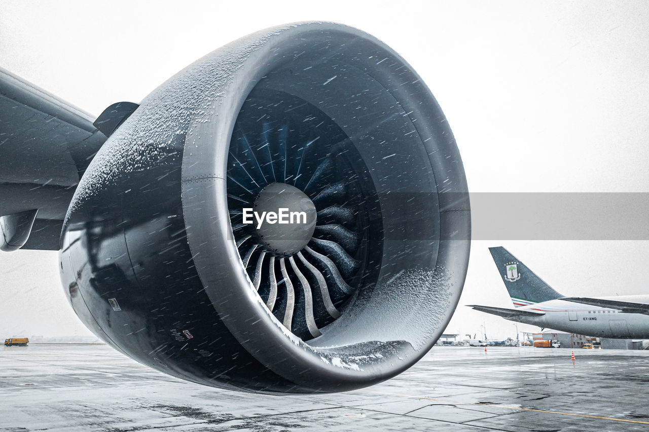 CLOSE-UP OF AIRPLANE WHEEL IN SNOW