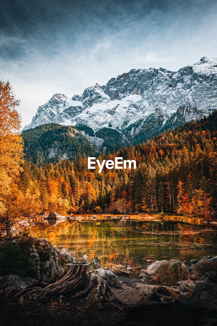 Scenic view of snowcapped mountains against sky during autumn