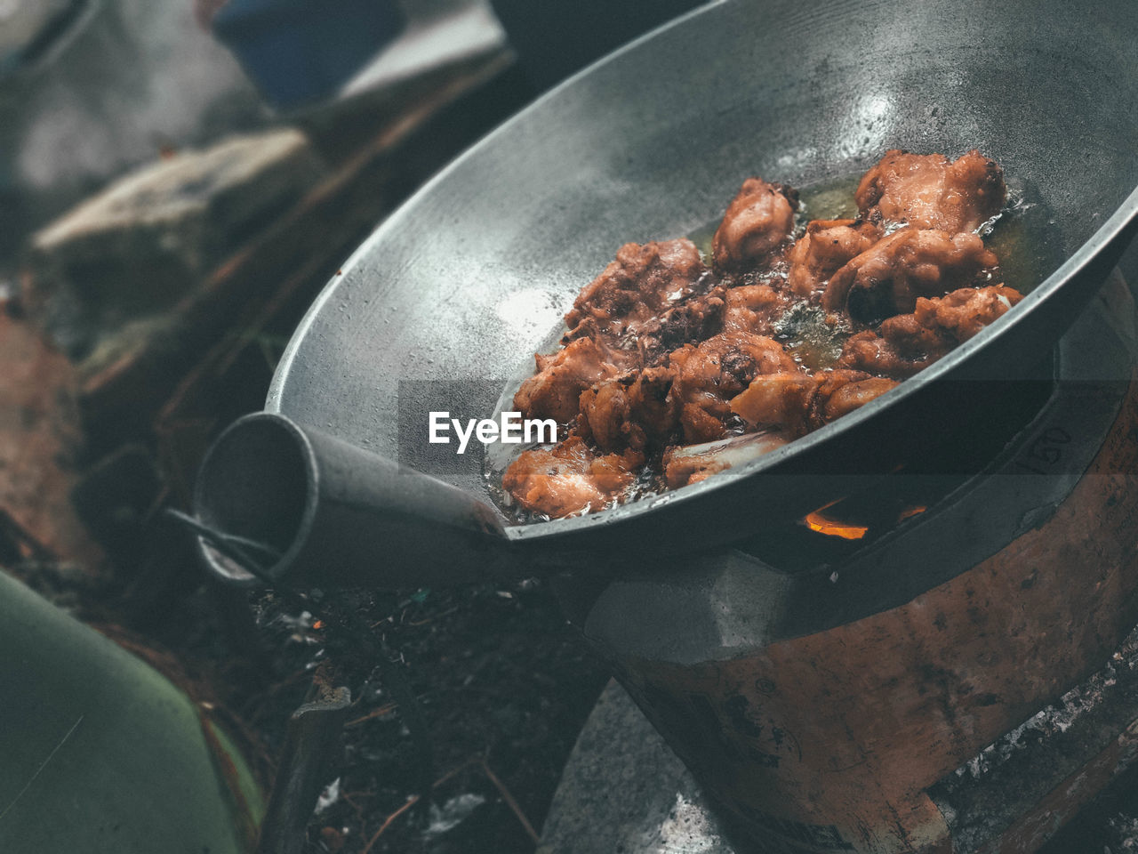 CLOSE-UP OF MEAT ON BARBECUE