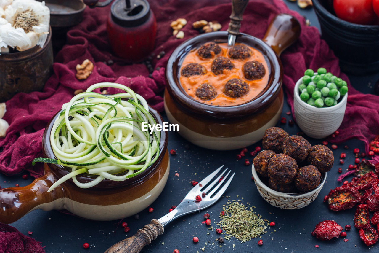 HIGH ANGLE VIEW OF VARIOUS FOOD ON TABLE AT HOME