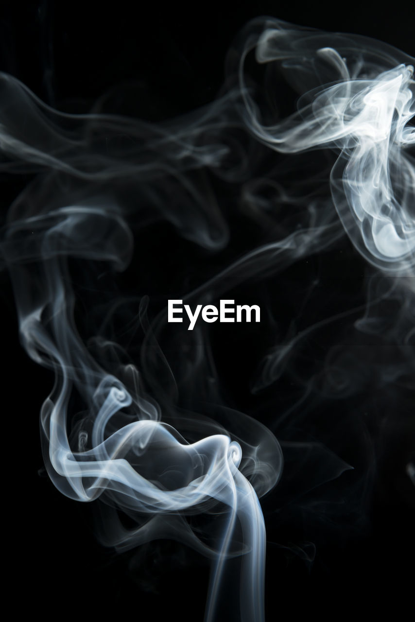 Close-up of smoke against black background