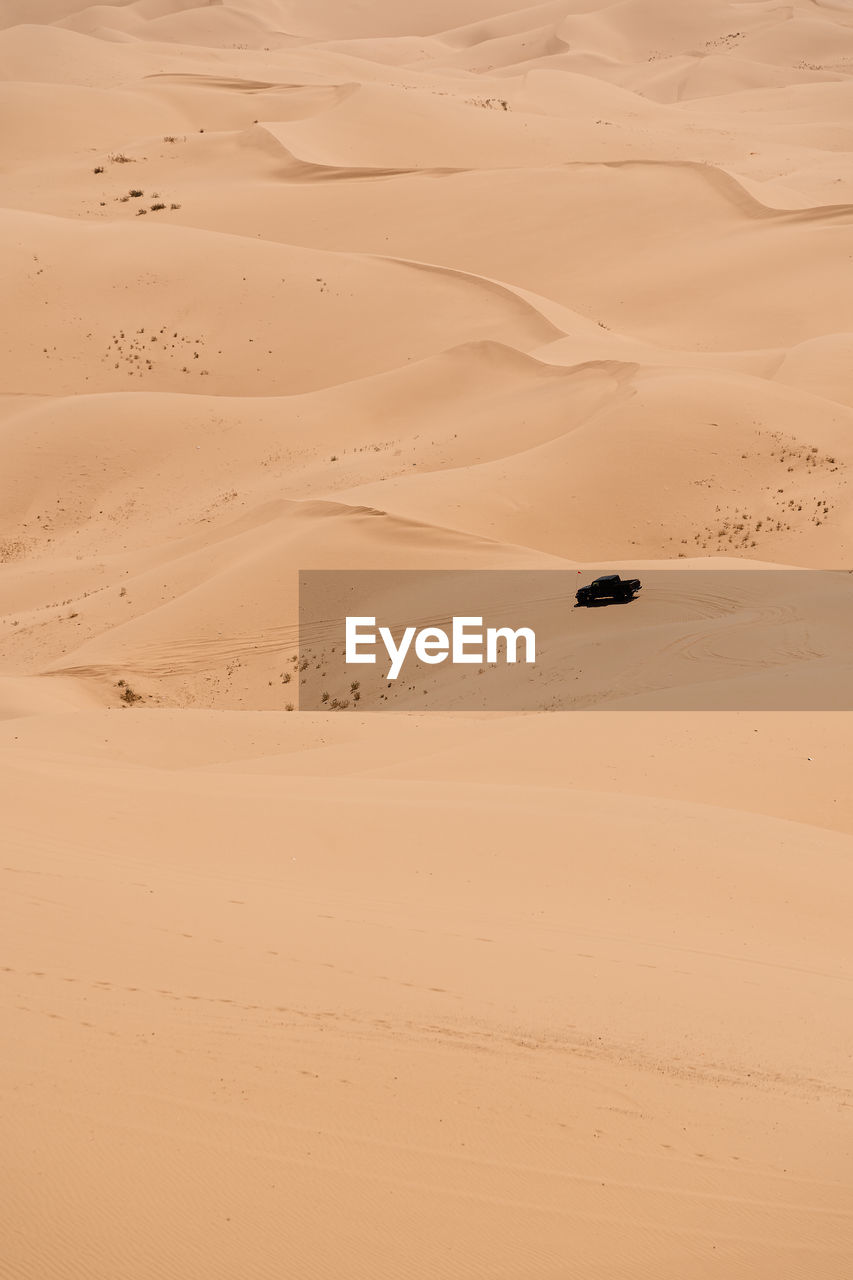 High angle view of truck on sand dune