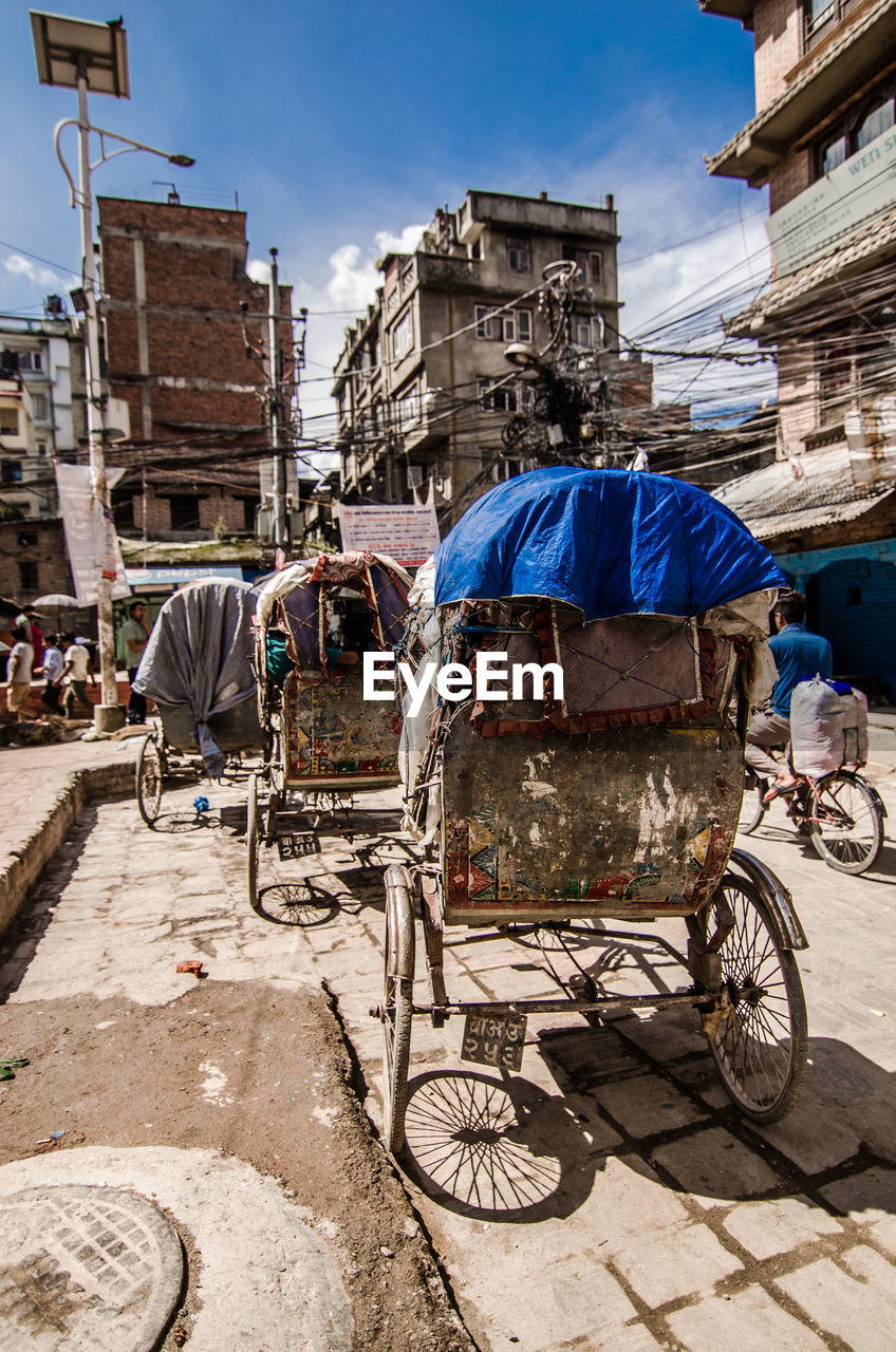 Pedicabs parked on street