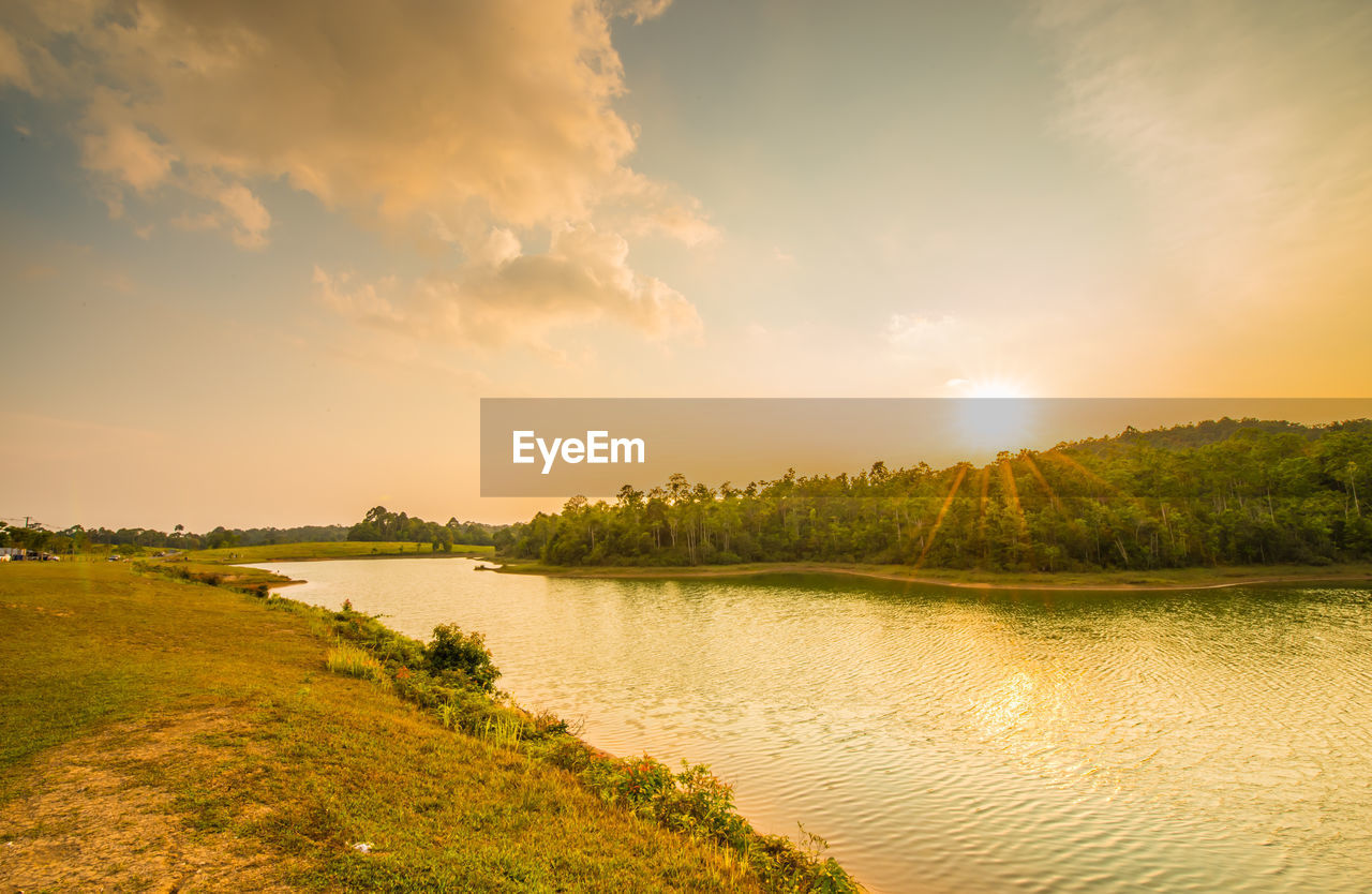 SCENIC VIEW OF LAKE DURING SUNSET