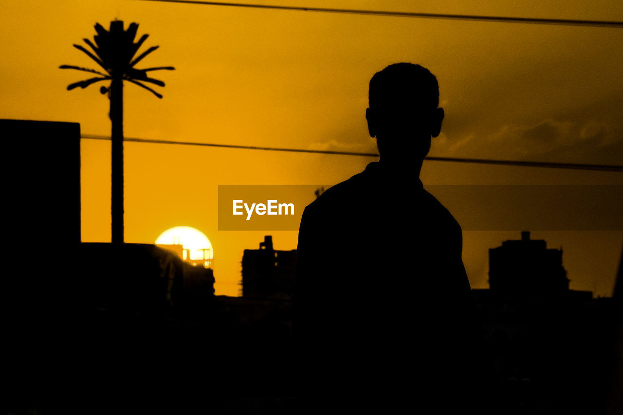SILHOUETTE OF MAN AT NIGHT