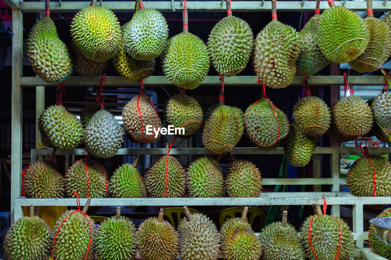 Whole durians - sales stand in kuala lumpur, malaysia. the king of the fruit.