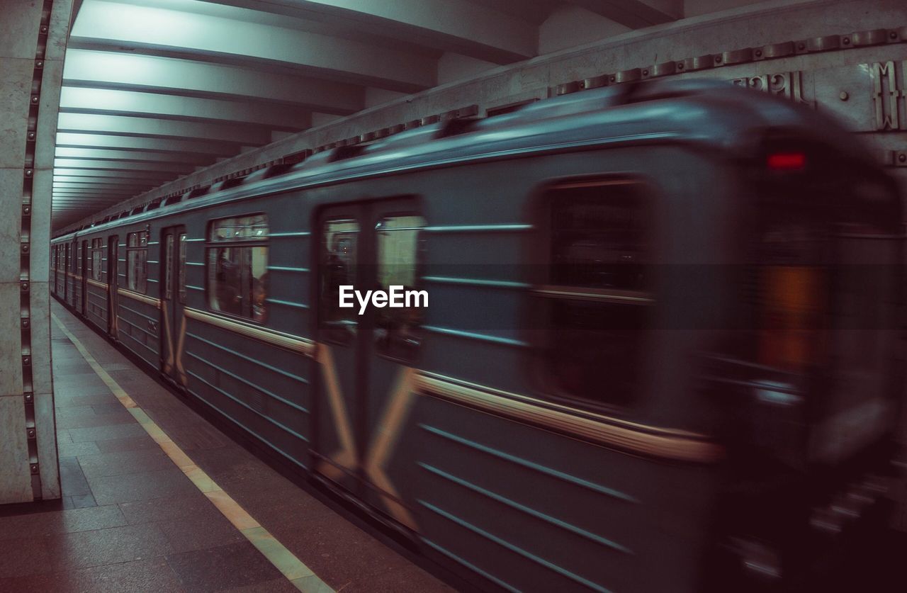 TRAIN AT SUBWAY STATION