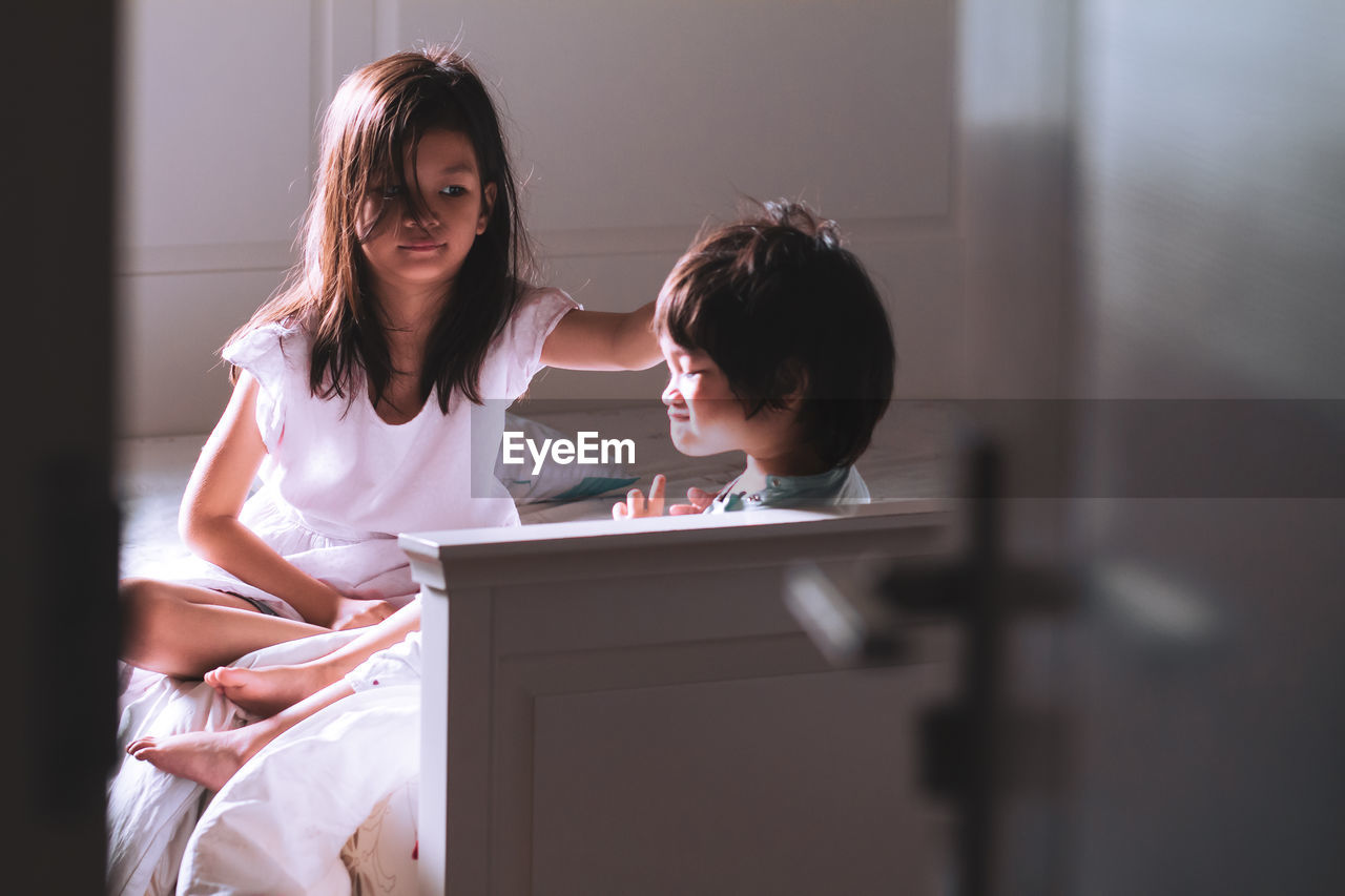 Cute kids sitting at home